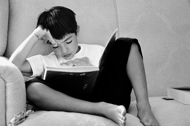 One of our male students reading.
