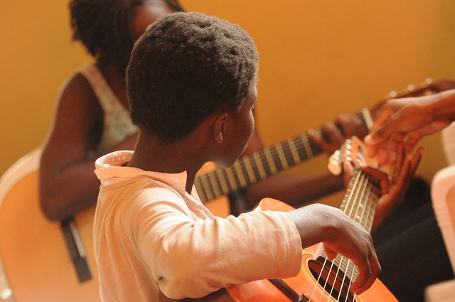 A few students playing guitar.