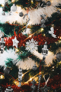 A Christmas tree with ornaments showing and not showing.