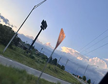 A picture of a sunset on the highway.