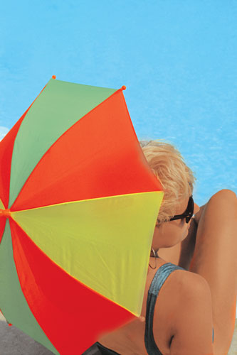 A picture of a lady under an umbrella.