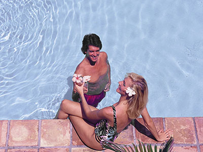 A picture of a woman and man in a pool.