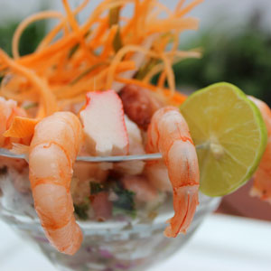 A photo of shrimp in a wine glass.