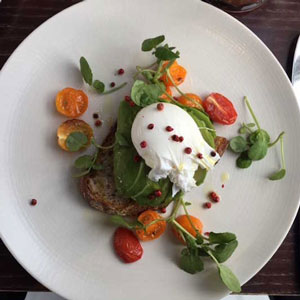 A picture of toast with lots of toppings.